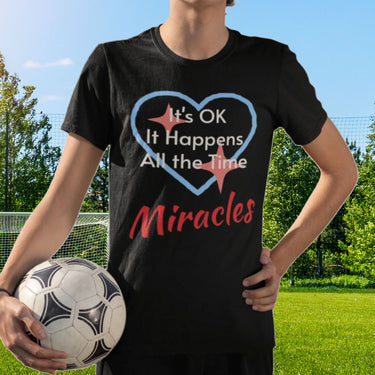 Bella+Canvas youth unisex t-shirt with “Miracles Happen” design and uplifting message, Christian apparel made from soft cotton, ideal for active kids and faith-inspired everyday wear, boy in black t-shirt
